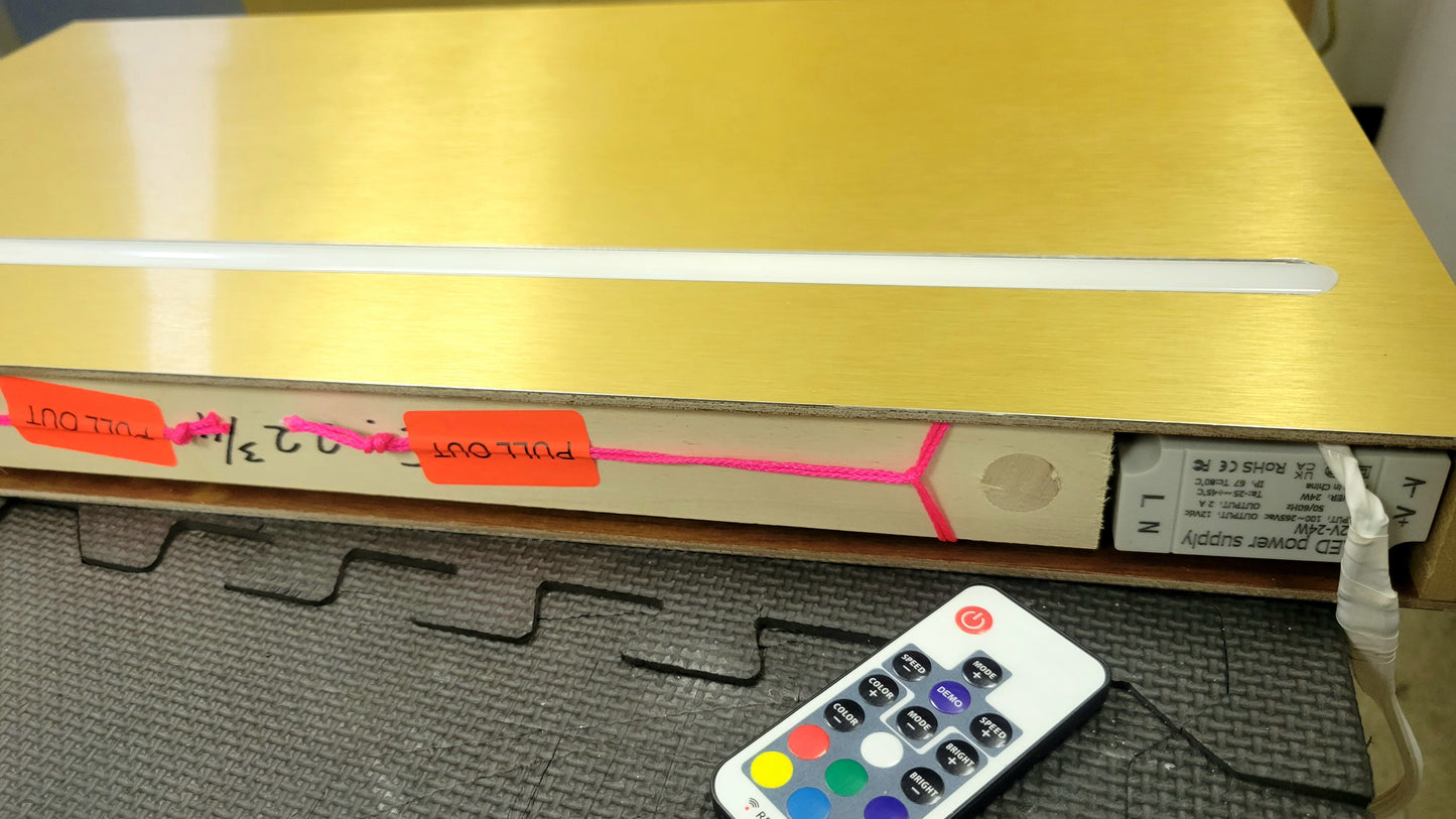 Wooden floating shelf with LED lights and gold stainless steel accents.